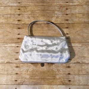 Small silver shiny clutch